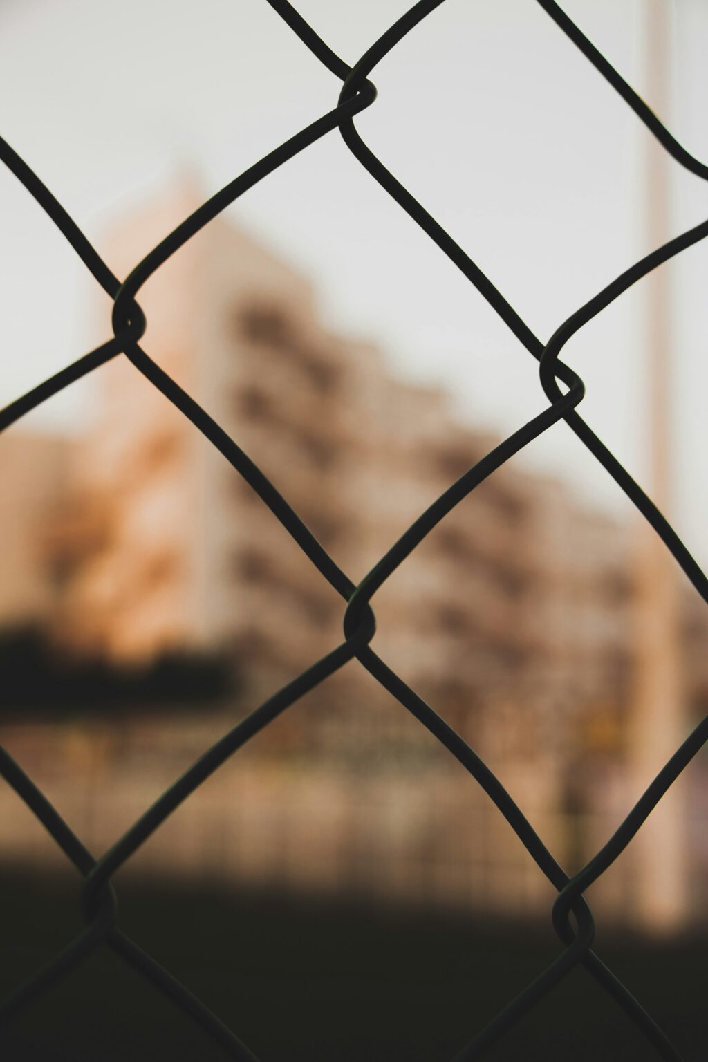 Building site viewed through a temporary fence